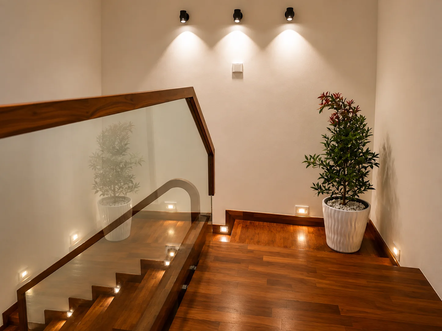 Polished wooden staircase landing with integrated lighting